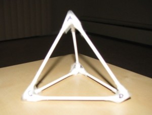 A model tetrahedron made of Q-tips and scotch tape.